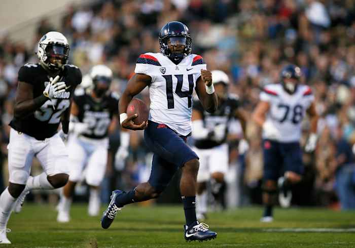 Oct 7, 2017; Boulder, CO, USA; Arizona Wildcats quarterback Khalil Tate (14) runs for a first quarter touchdown against the Colorado Buffaloes at Folsom Field. Mandatory Credit: Russell Lansford-USA TODAY Sports